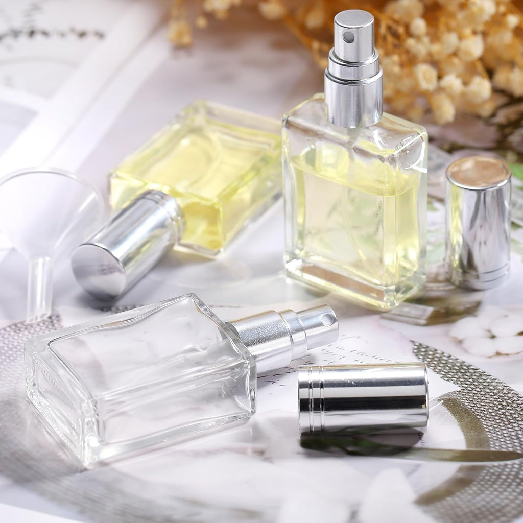 15ml square glass perfume bottles with silver caps on a textured surface