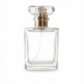 50ml square clear glass perfume bottle with a faceted transparent cap and metallic gold collar
